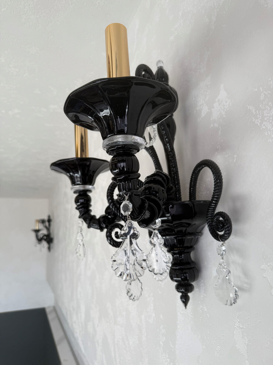 Black crystal wall light installed